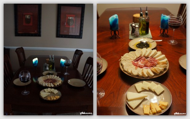 Romantic Candlelit dinner at home. – slices of Prosciutto (wild boar), French bread and olive oil with herbs dip, Manchego Cheese, Classic Vermont Cheddar Cheese (sharp), Old Amsterdam and Jam Jar (Sweet Shiraz, 2011).