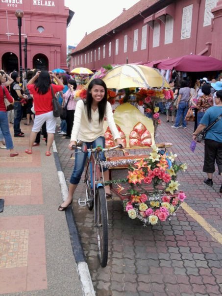 Being a tourist in front of The Stadthuys, which means a city hall in old Dutch and is also known as the Red Square, at downtown Malacca in Malaysia. Being a tourist in front of The Stadthuys, which means a city hall in old Dutch and is also known as the Red Square, at downtown Malacca in Malaysia.