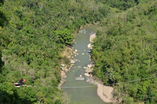 View looking down during a Suislide zipline at E.A.T. Danao (Extreme/Eco/Educational Adventure Tour), Bohol, Philippines.