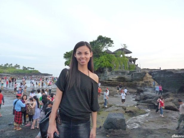 Tanah Lot in Bali, Indonesia is a popular rock formation shaped continuously over the years by the ocean tide with a temple built for worship of the Balinese gods.