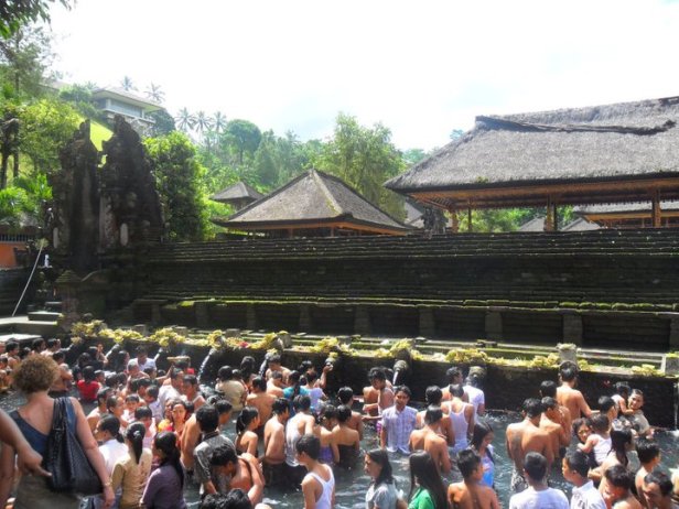 Balinese bathe at the holy spring Tirta Empul during Saraswati festival in Tampak Siring Village in Bali, Indonesia.