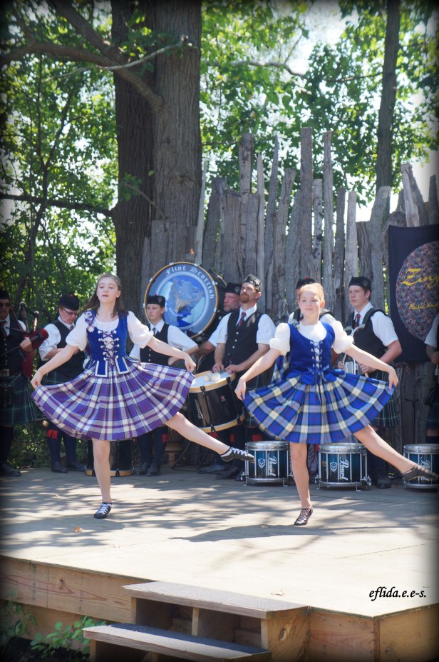 Ladies dancing to the music of Flint Scottish Pipe Band at Michigan Renaissance Faire. Ladies dancing to the music of Flint Scottish Pipe Band at Michigan Renaissance Faire.