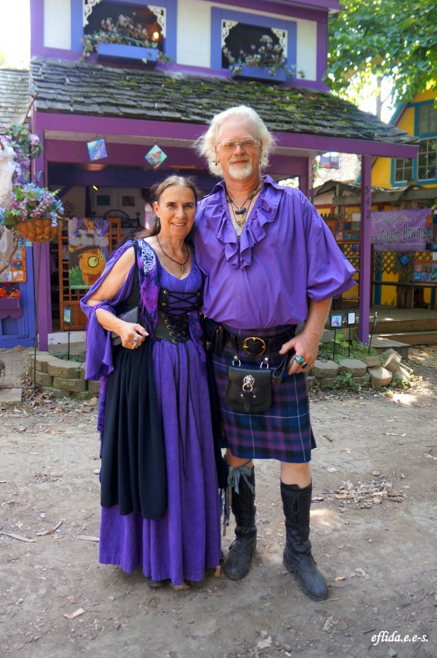A couple dressed in purple garb at Michigan Renaissance Faire.
