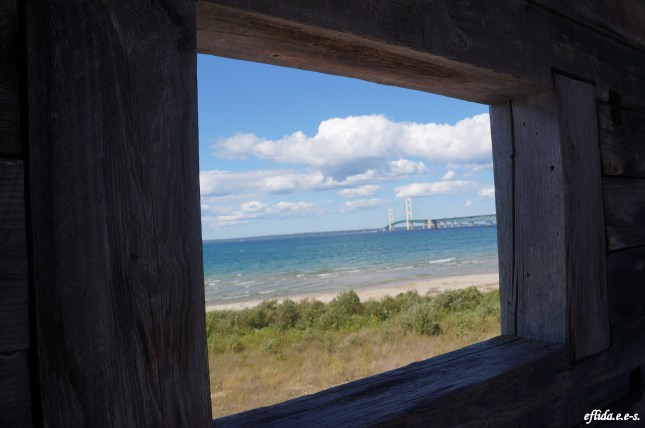 Peek of Lake Michigan and Mackinac Bridge from Fort Michilimackinac watchtower.