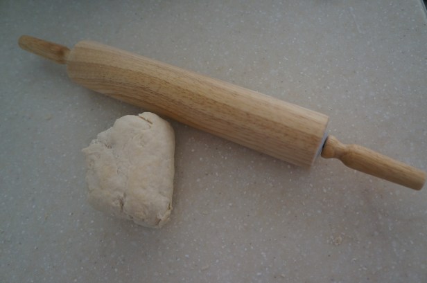 Rolling the dough for naan bread.