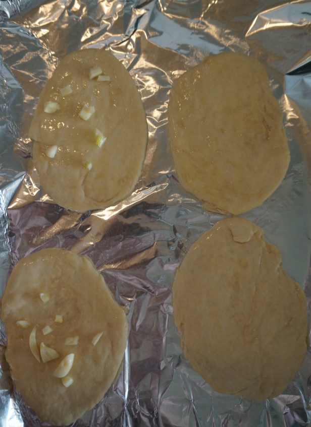 Rolled dough are placed in a greased tray and baked for 10-15 minutes.