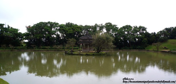 The hexagonal pavilion in the middle of the pond at Shikinaen Garden in Okinawa, Japan.