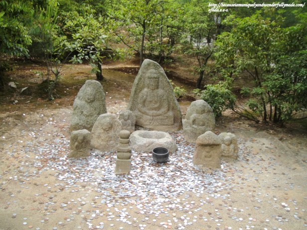 Statues for coin toss inside Kinkaku-ji in Kyoto, Japan. Statues for coin toss inside Kinkaku-ji in Kyoto, Japan.
