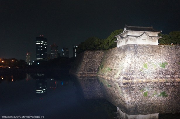 Osaka Castle 大坂城 with the city lights in the background in Chūō-ku, Osaka, Japan. Osaka Castle 大坂城 with the city lights in the background in Chūō-ku, Osaka, Japan.
