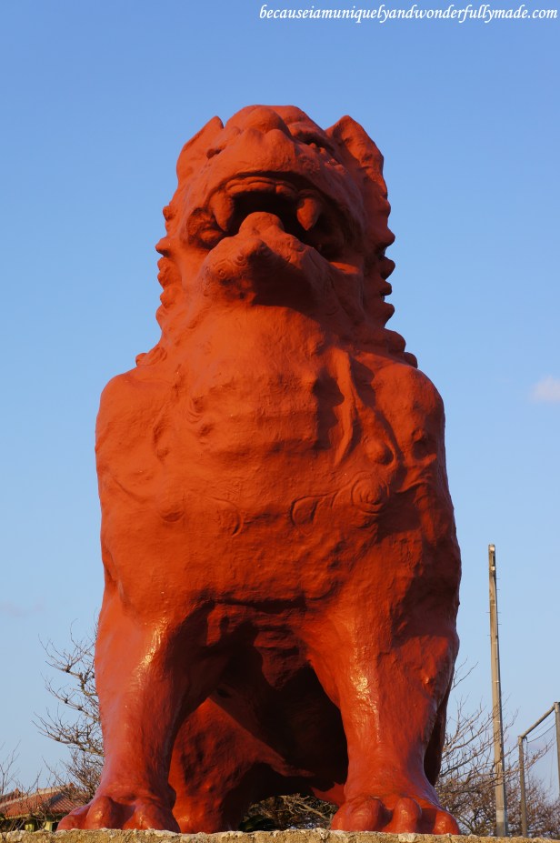 The giant Shisa guarding the entrance to Zanpa Misaki Recreation Plaza at Cape Zanpa in Yomitan, Okinawa, Japan.