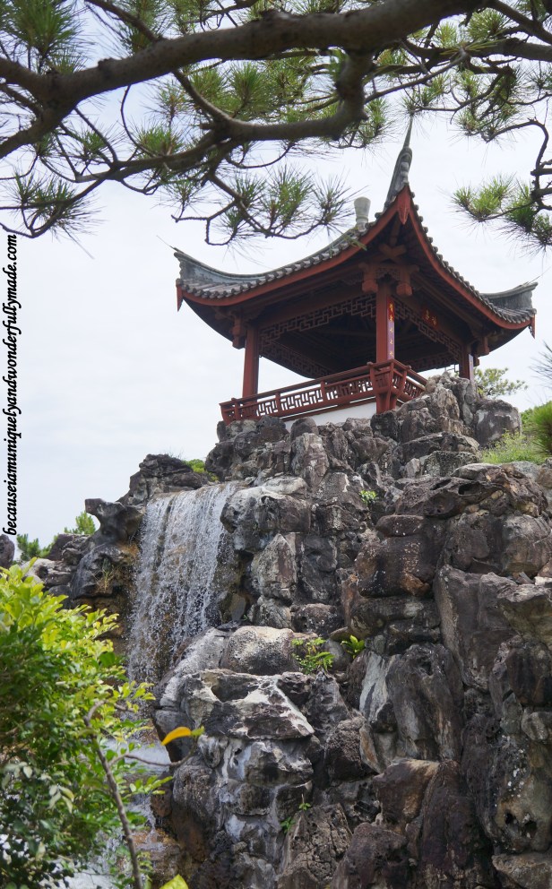 The artificial waterfall at Fukushuen Garden 福州園 in downtown Naha 那覇市 Okinawa 沖縄本島, Japan 日本国.