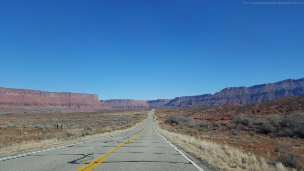 Driving on the scenic 44 mile long Utah State Route 128, also famous as the Upper Colorado River Scenic Byway in Moab, Utab, USA to see the Fisher Towers.