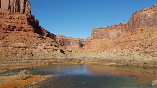 Driving on the scenic 44 mile long Utah State Route 128, also famous as the Upper Colorado River Scenic Byway, along the Colorado River in Moab, Utab, USA.