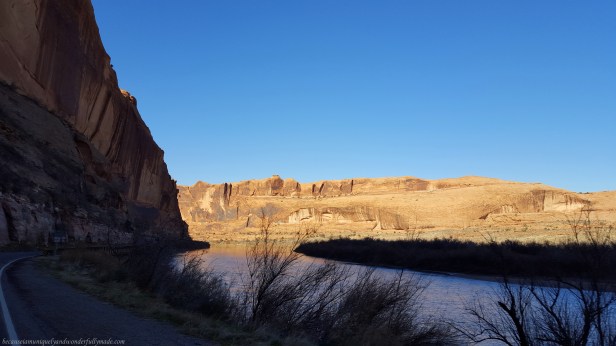 Driving on the scenic 44 mile long Utah State Route 128, also famous as the Upper Colorado River Scenic Byway, along the Colorado River in Moab, Utab, USA.