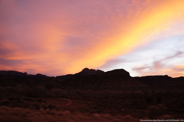 A pinkish-orange sky during sunset at Springdale Utah after exploring Zion National Park.
