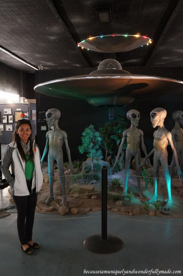 Looking extremely delighted after realizing that these life-size mechanical aliens at International UFO Museum and Research Center in Roswell, New Mexico actually move.